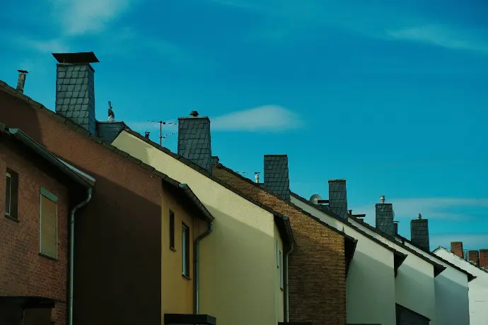brown concrete building roofs under blue sky during daytime